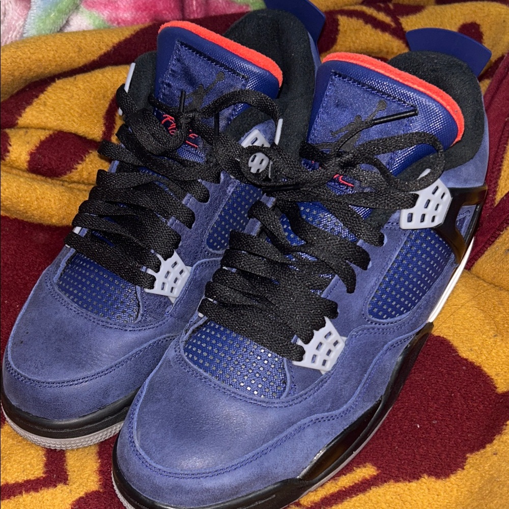 Air Jordan 4 retro wntr- Jordan Blue and Black Sneakers with Red Accents